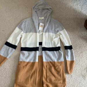 Never worn! Soft hooded cardigan. Machine washable! Perfect for all seasons!